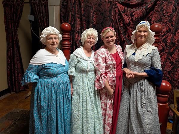 Ladies posing for picture after performance at Say When