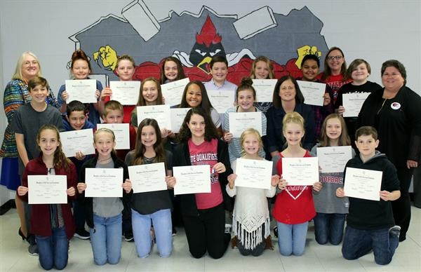 Adults:  Far left: Vicki McComack, Far Right:  Natalie Bauman,   Back row:  Assist Principal Shannon Edwards, second  row right:  Teacher, Mindy Hawthorne Winner of essay contest, front row center holding medal:  Sienna Wideman.