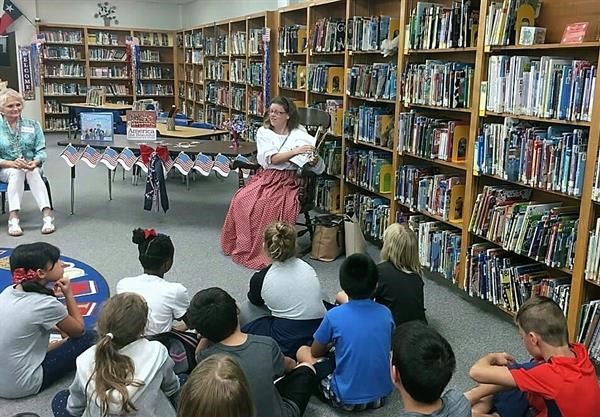 Michelle Alverson member of  Preston Trail NSDAR Regent reads to children during Constitution Week